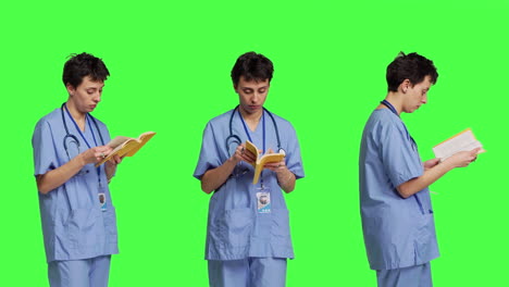 Medical-assistant-reading-a-literature-book-against-greenscreen-backdrop