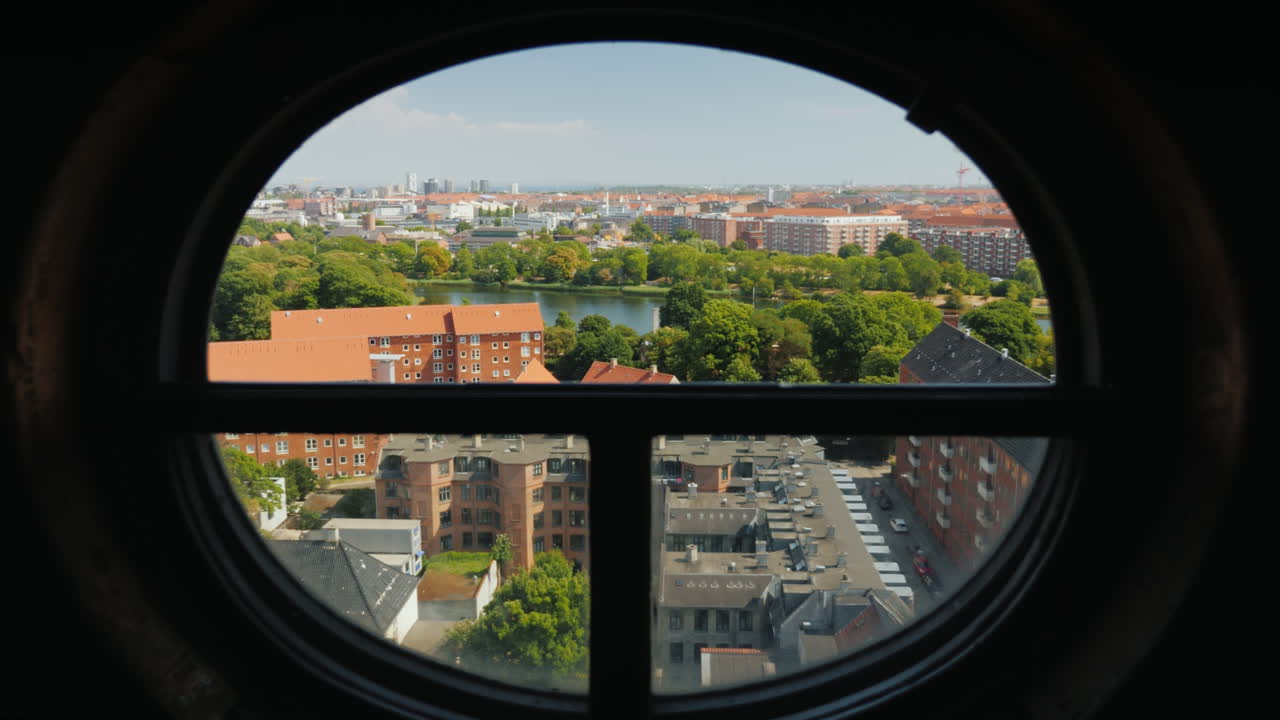 View Of The City Of Copenhagen Through The Ancient Round Window Of The Screw Tower 4k Video