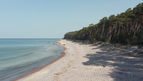 aerial: flying above karkle beach in klaipeda on a sunny day