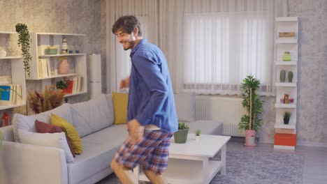 Funny-young-man-dancing-and-having-fun-at-home.