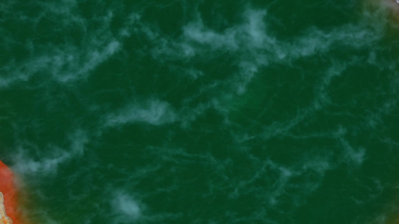 Deep green geothermal water shows swirling mineral patterns across the surface.