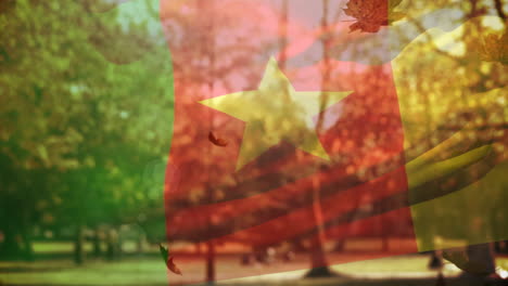 digital composition of ghana waving flag over multiple autumn leaves falling against park