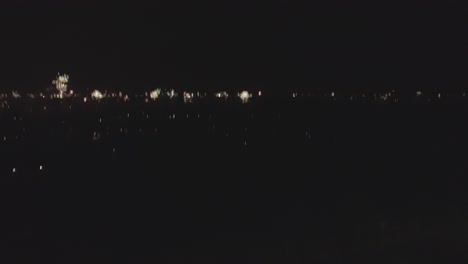 moving skyline shot of new years fireworks, from left to right