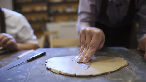 clay sculpting in a pottery workshop