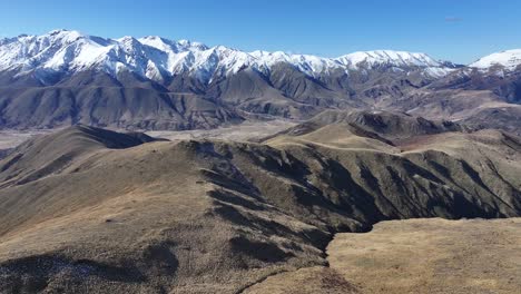 drone fly above mountain, reveal beauty in nature, new zealand winter