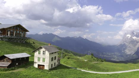 View-To-Kleine-Scheidegg-From-Mannlichen-With-Eiger,-Monch-And-Jungfrau-Mountain-In-The-Background,-Berner-Oberland,-Grindelwald,-Switzerland