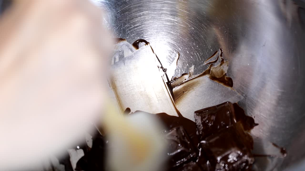 Melting chocolate in a sauce pan with a spatula