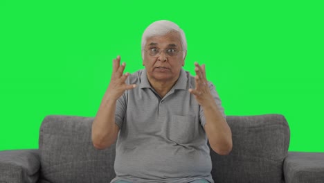 Angry-Indian-old-man-shouting-on-someone-Green-screen