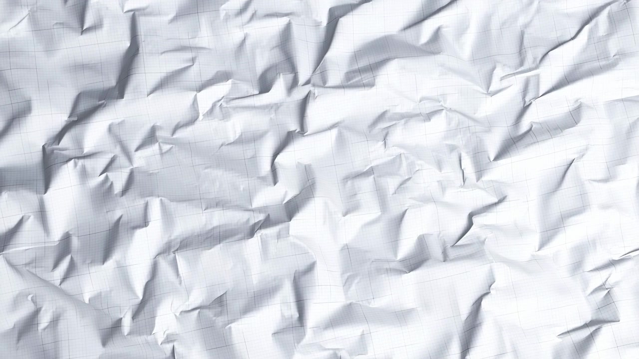 Close-up of wrinkled white paper with faint grid pattern, dense creases, soft gray shadows, and crumpled texture under bright high-key light, creating minimal abstract backdrop for design use