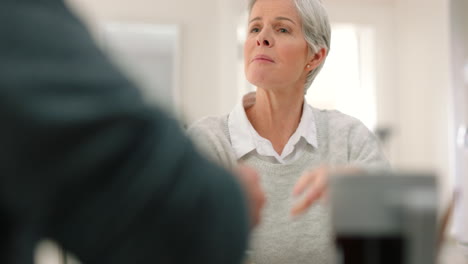 Healthy-senior-woman-with-orange-juice-talking