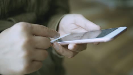 man using smartphone on metro station