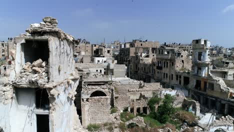 the streets of the historic city centre of aleppo in syria. we still can see buildings destroyed even 10 years after the war - aerial view 4k