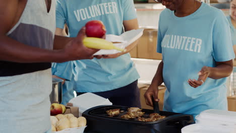 friendly volunteers serve the homeless