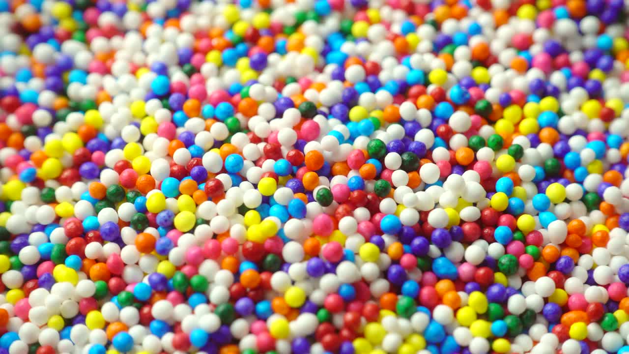 Rotating of colorful sugar sprinkles (cake decors), 4K