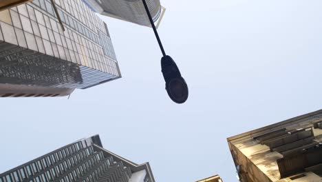 Looking-Up-at-Lamppost-and-Tall-Buildings