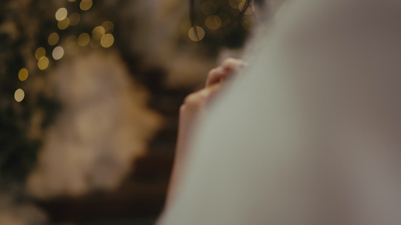 Woman holding a green screen photo at Christmas
