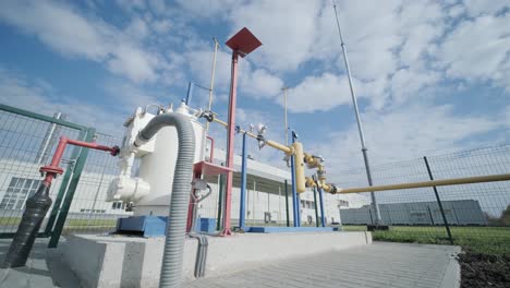 gas distribution station. industrial facility. gas processing station with pipes on a summer day in an open space. gas supply. transportation of natural gas through pipes.