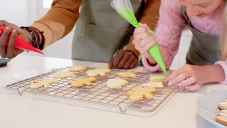 decorating christmas cookies together, couple enjoying festive baking at home
