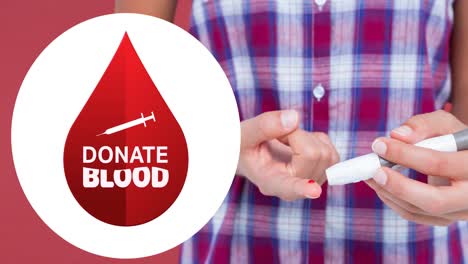 Animation-of-donate-blood-text-with-syringe-and-droplet-logo-over-man-taking-pinprick-blood-test