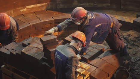 workers constructing furnace lining