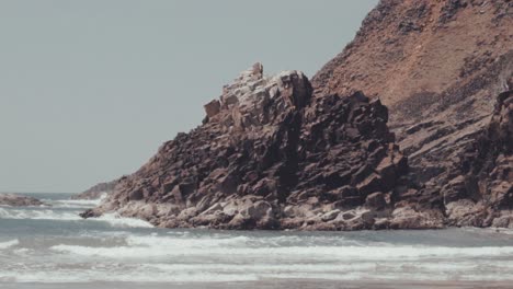 waves hitting giant rocks on oregon coast