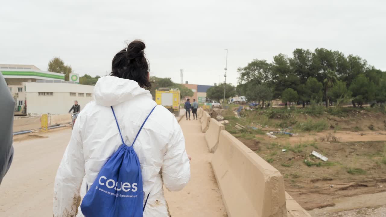 Fire trucks from Castilla y León crossing a bridge damaged by Valencia DANA