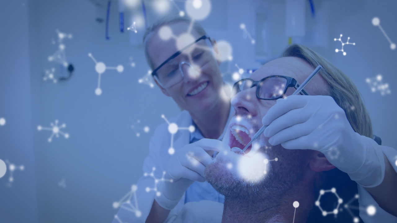 animación de moléculas sobre una dentista caucásica y un paciente masculino