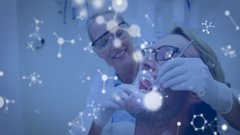 animación de moléculas sobre una dentista caucásica y un paciente masculino