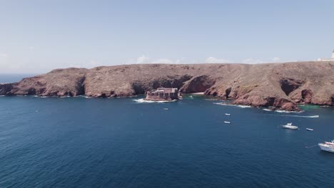 wide aerial orbit of tourist destination fort of the berlengas