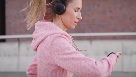 tilt up video shows of jogging woman in the city