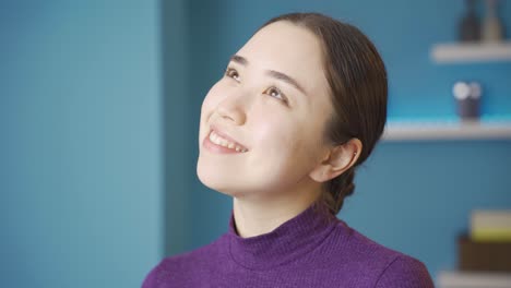 Charming-Asian-woman-cheerfully-reflects-on-her-past-memories.