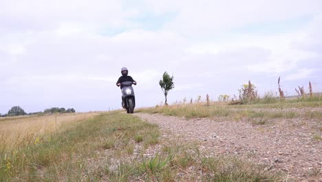 moped scooter drive towards camera.