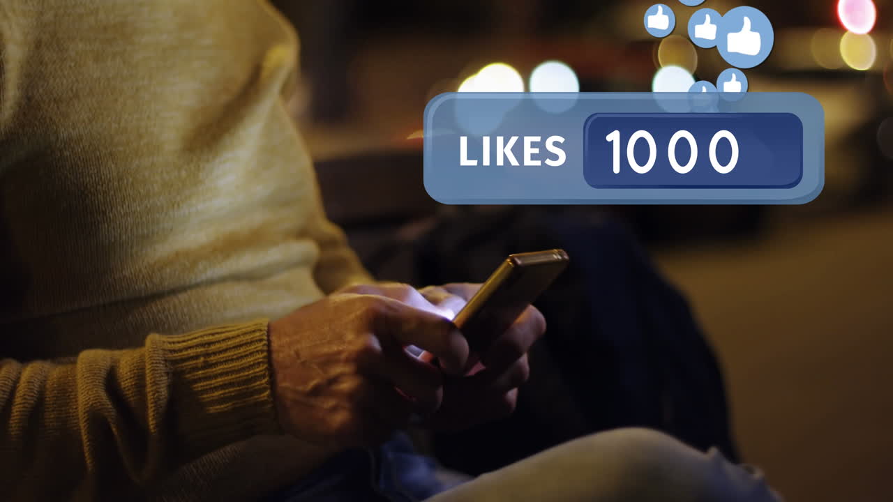 Man sitting on a bench while typing on his phone 4k