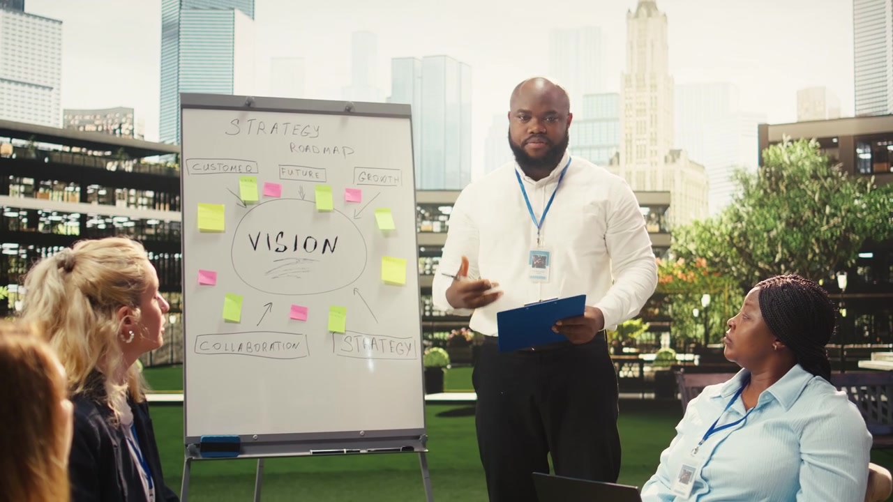 Business Professional Leading a Strategy Meeting on an Outdoor Office Terrace
