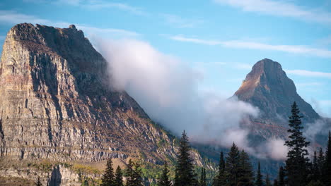 time lapse, mountain peaks and clouds formations at high elevation on sunny summer day