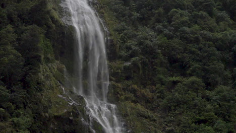 slow motion static footage of a three-pronged waterfall in doubtful sound - patea, new zealand