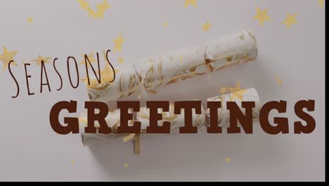 Animation-of-christmas-greetings-text-over-christmas-crackers