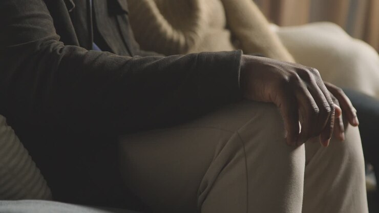Close Up Of Nervous Man About To Propose To Woman Checking Ring Box In Pocket