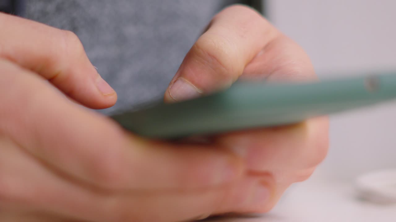 Slow Motion of Male Thumbs Typing Reply on Smartphone. Social Media Engagement on Modern Technological Device. Replying and Sending Emails Remotely