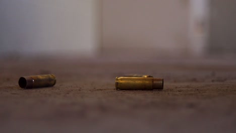 bullet casing hitting the floor, rifle cartridge