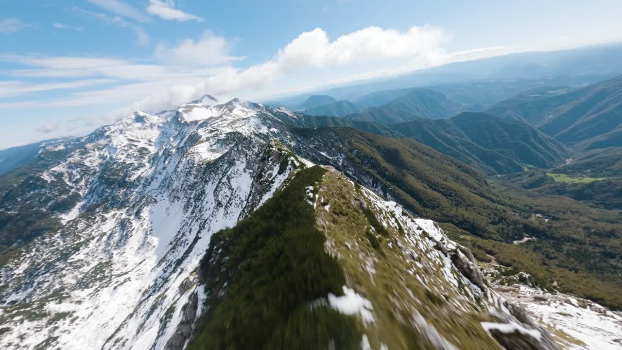 FPV drone proximity flight by an edge of a big mountain in Slovenian alps