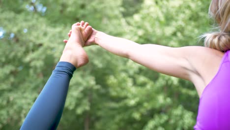 Close-up-view-of-a-woman-doing-yoga-outside-in-a-park