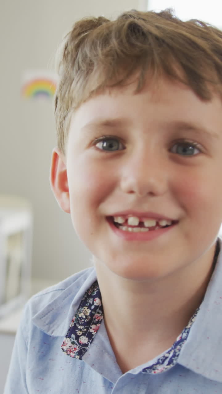 Video of happy caucasian boy standing in class during lessons