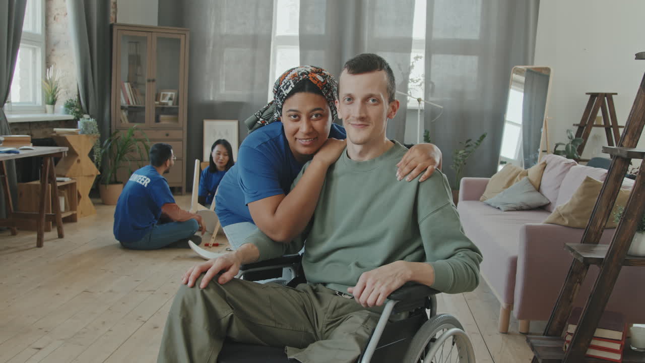 Portrait of Disabled Man with Female Volunteer