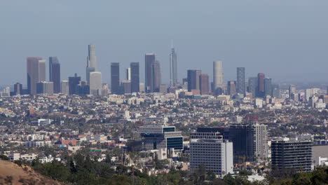 Long-lens-view-of-Downtown-Los-Angeles-with-Hollywood-in-foreground