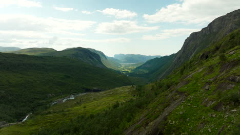Lush green landscape in Norway. Aerial forward, copy space