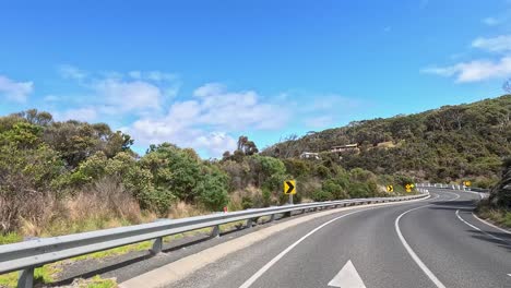 a 45-second video capturing a drive on great ocean road, showcasing winding roads, lush greenery, and coastal views under clear skies