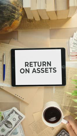 vertical video of return on assets displaying on finance tablet screen