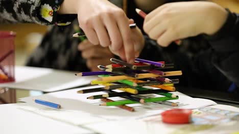 children paint pencils