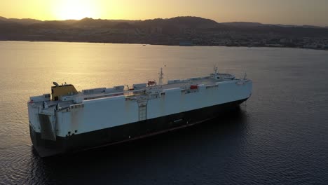 car carrier at sunset over the sea